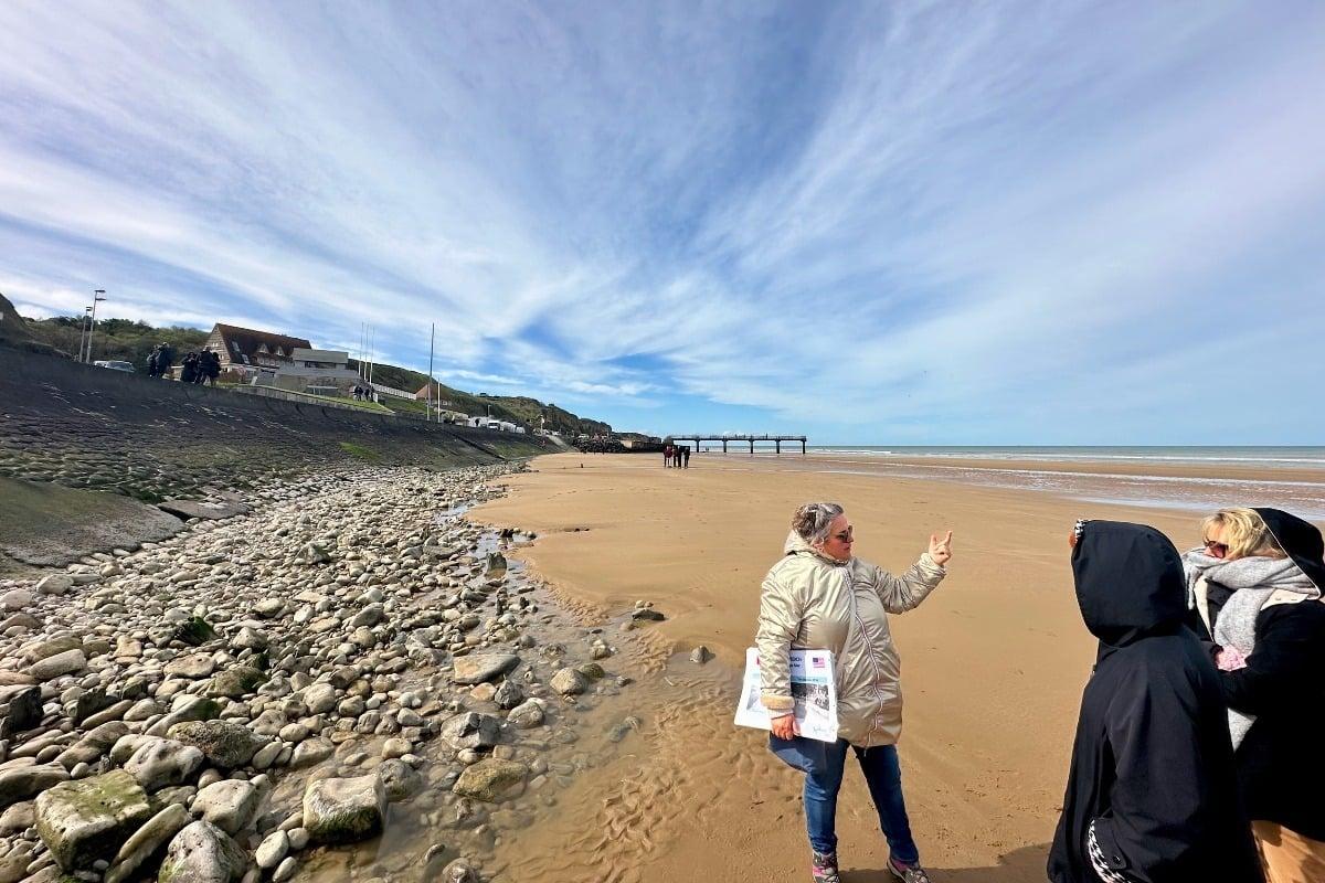 A guide with guests on Omaha Beach